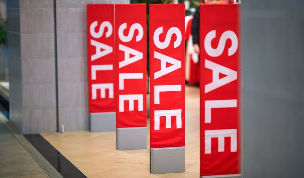 Sale sign at the entrance to clothing store