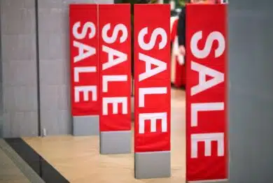 Sale sign at the entrance to clothing store