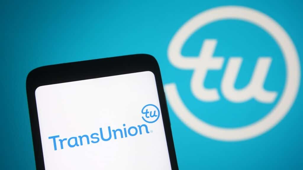 TransUnion Holding Company, Inc logo is seen on a mobile phone and a computer screen.