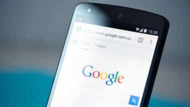 Closeup photo of brand new Google Nexus 5, powered by Android 4.4 version, with Google search webpage in Chrome browser on a screen.
