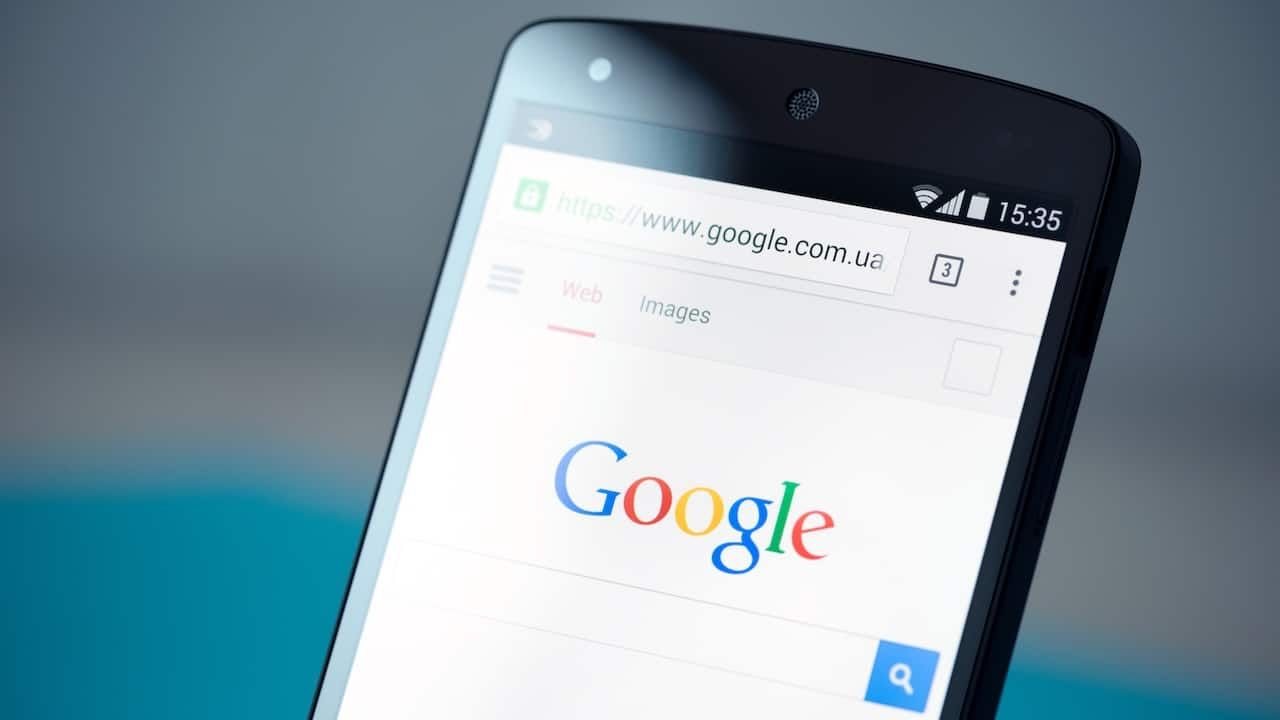 Closeup photo of brand new Google Nexus 5, powered by Android 4.4 version, with Google search webpage in Chrome browser on a screen.