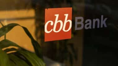 CBB Bank logo is seen at the entrance to one of its branches in Irvine, California. Commonwealth Business Bank (CBB Bank) is a traditional full-service business bank.