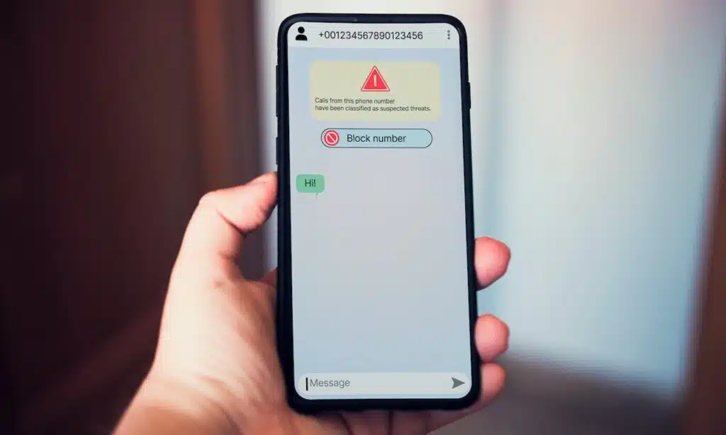 Woman receives message on smartphone from suspected number scam.