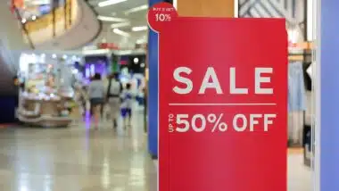 Signs announcing the start of sales in the store, sale signs in front of the store, discounts up to 50 percent,
