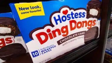 Packages of Hostess Ding Dongs Chocolate Cake Brand Baked Goods Treats Snacks Donuts Logo Display Boxes on Shelf