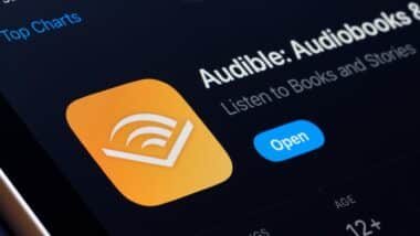 Audible App Store listing on iPhone highlights audiobooks and podcast listening. S