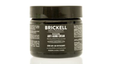 A jar of Brickell anti aging cream on an isolated background. See less