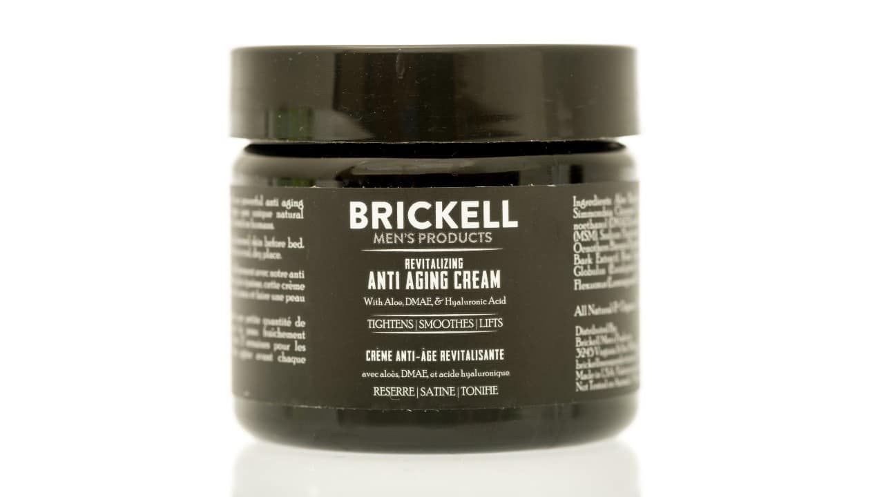 A jar of Brickell anti aging cream on an isolated background. See less
