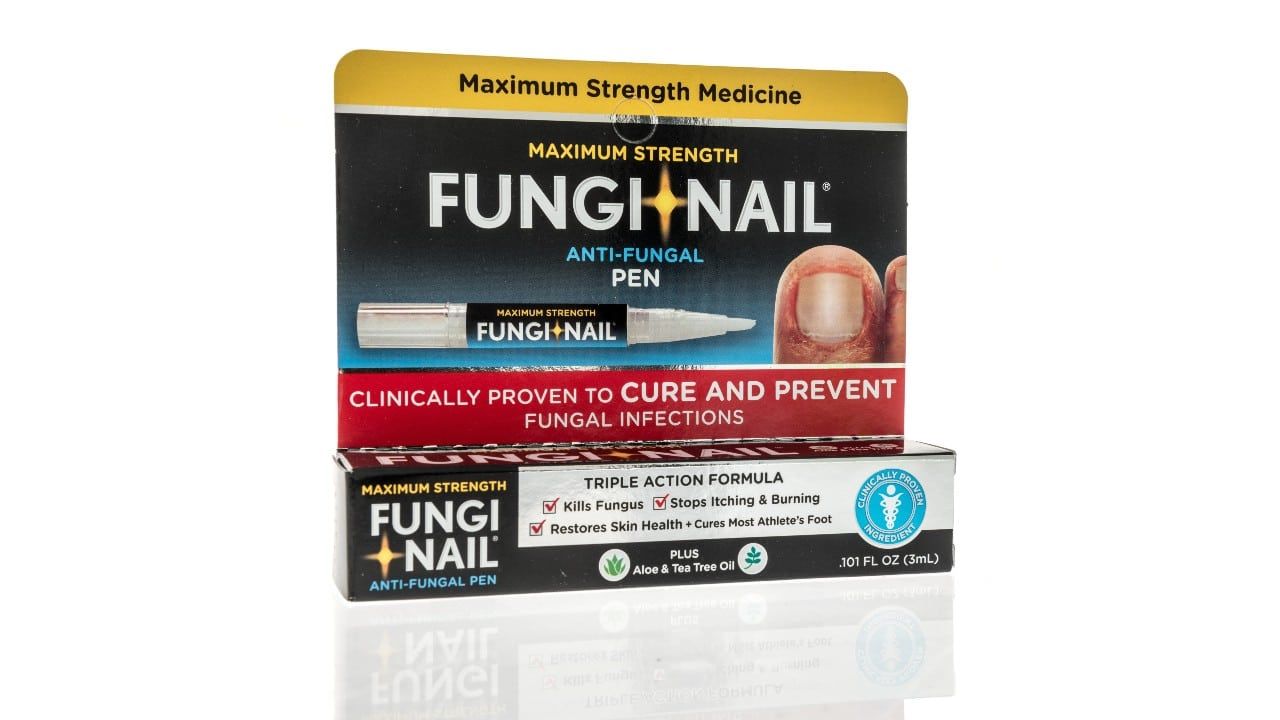 A package of Fungi nail applicator pen tea tree oil nail renewal on an isolated background.