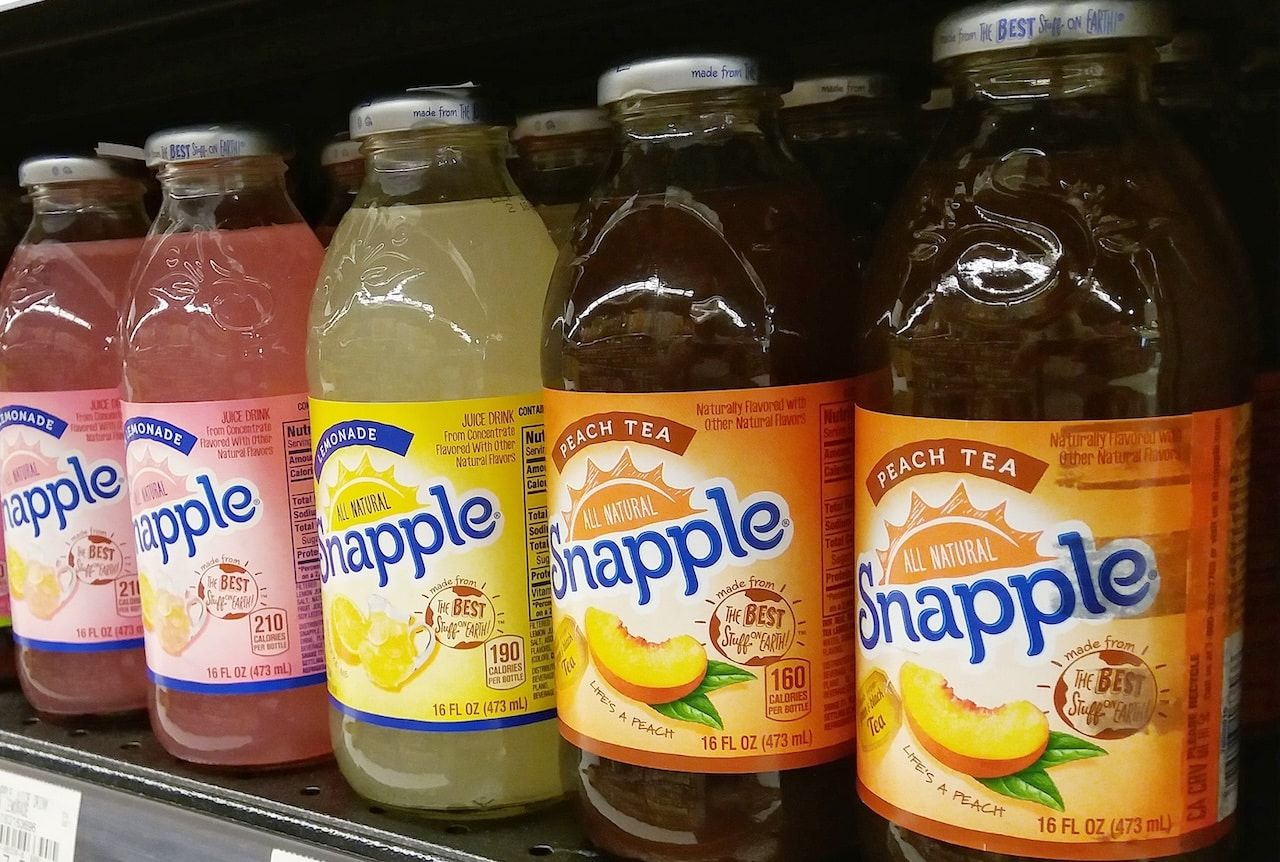 Assorted of Snapple drink bottles display in the supermarket shelves.
