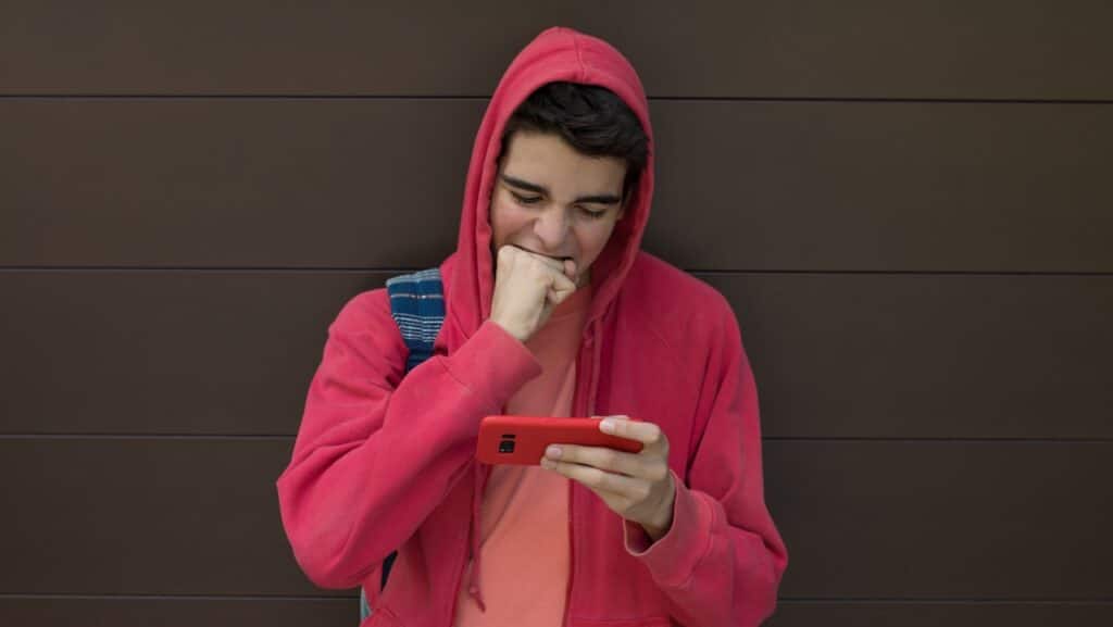 desperate young man with mobile phone