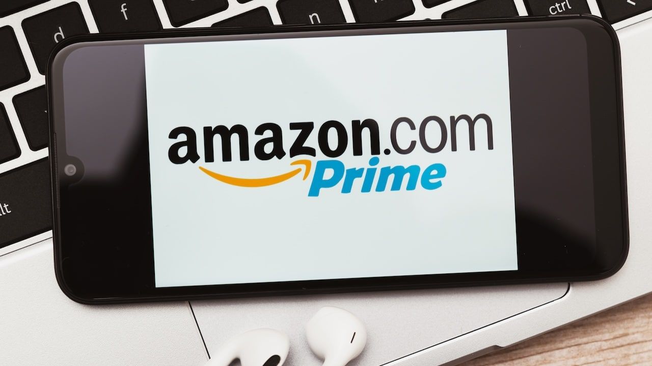 Amazon Prime sign on the smartphone screen. Amazon Prime is a paid subscription service