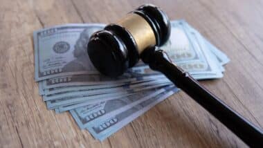 Closeup image of gavel and money