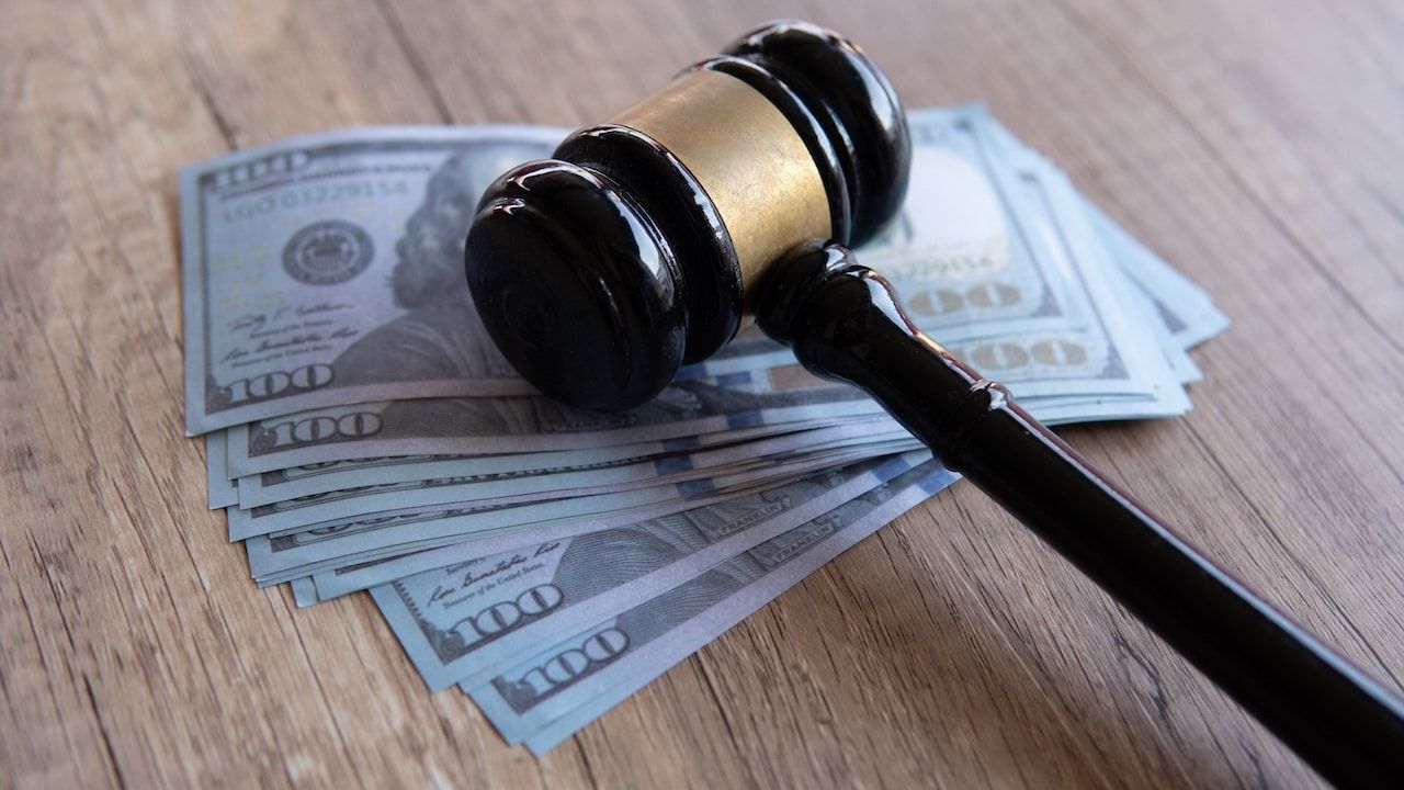 Closeup image of gavel and money