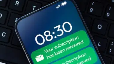 Subscription Renewal message notification in green color on the smartphone screen close up background