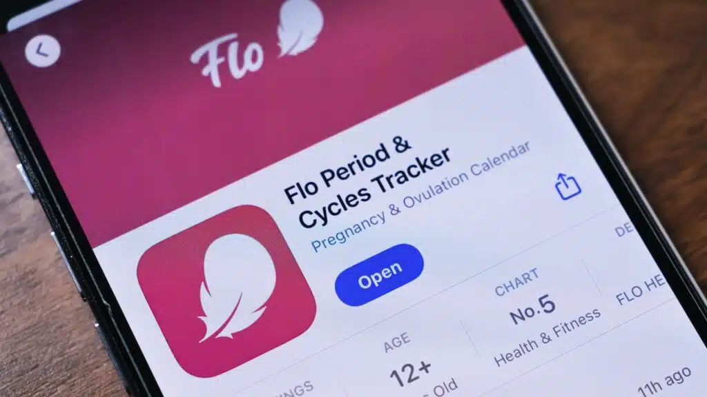 Close-up of a smartphone displaying the Flo app