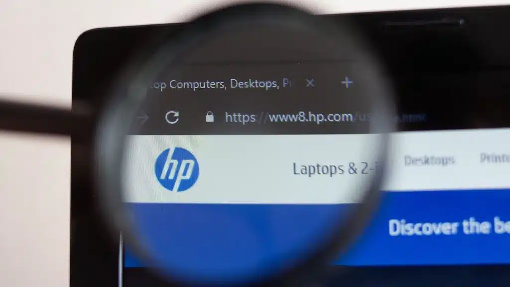 HP website homepage. HP logo visible on monitor screen