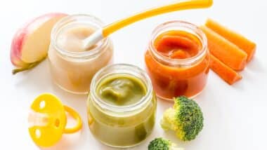 Vegetable and fruits puree for feed babies on white background