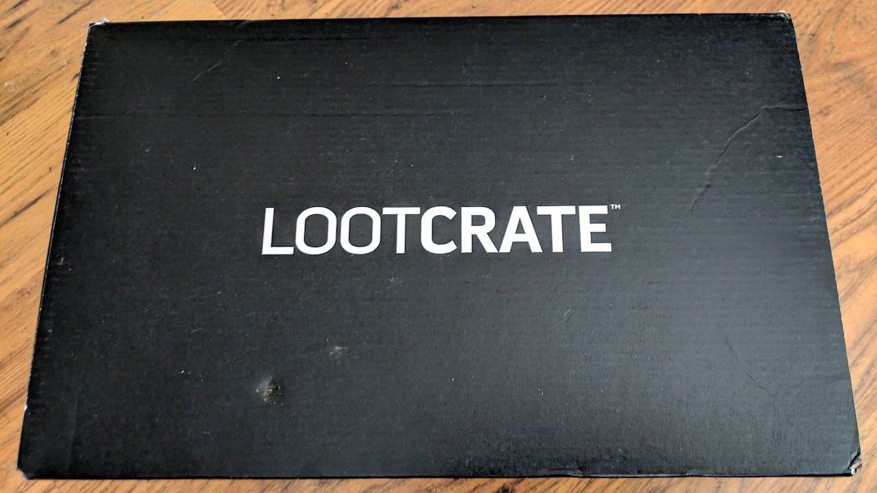Unopened LootCrate Box on wood floor.