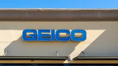 Close up of the GEICO sign on the building at one of its branches.
