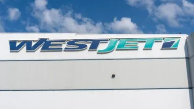 Close up of WestJet sign on the building at its World Headquarters in Calgary, Alberta, Canada