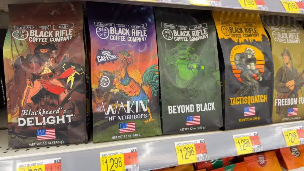 Bags of Black Rifle Coffee Company ground beans on store shelf.