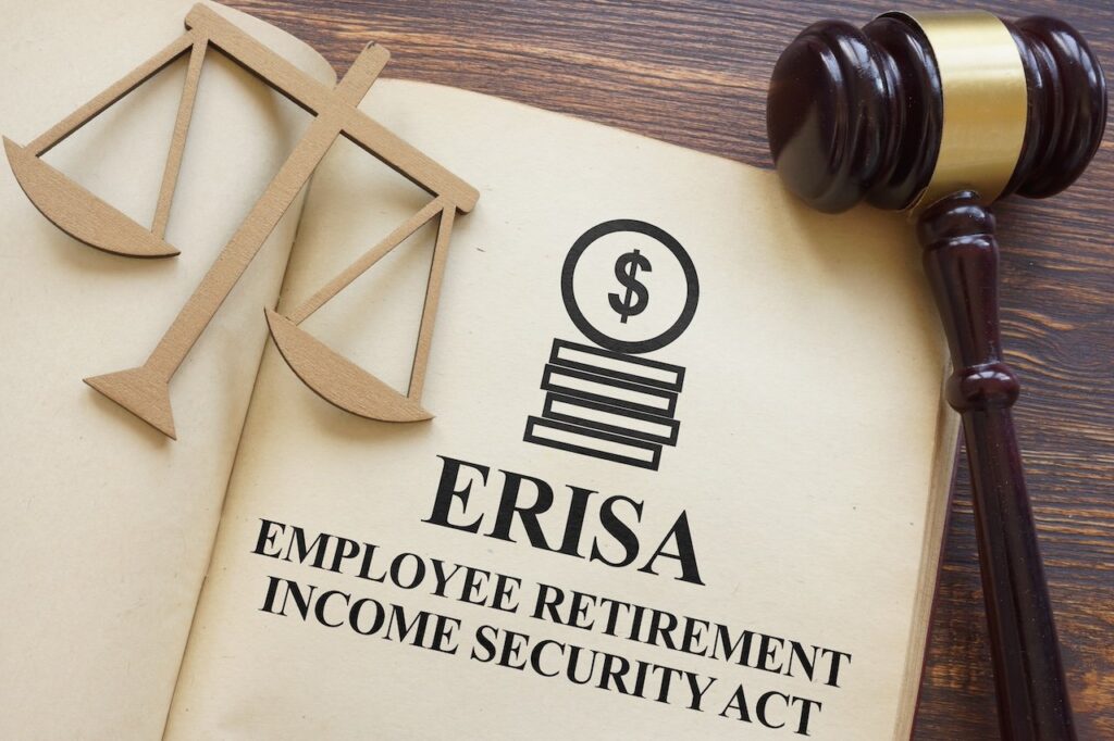 Page with ERISA The Employee Retirement Income Security Act of 1974 on a table.