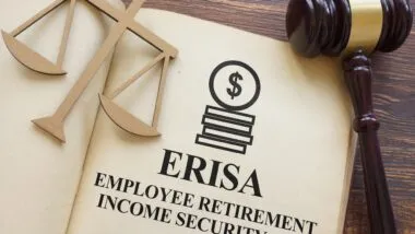 Page with ERISA The Employee Retirement Income Security Act of 1974 on a table.