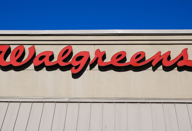 Red script logo sign on Walgreens store in closeup