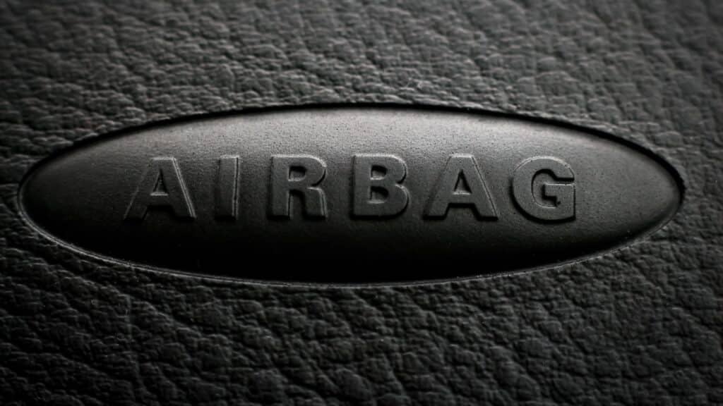 Close-up of airbag inscription on a car dashboard.