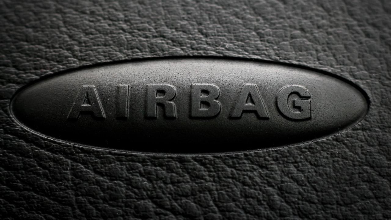 Close-up of airbag inscription on a car dashboard.