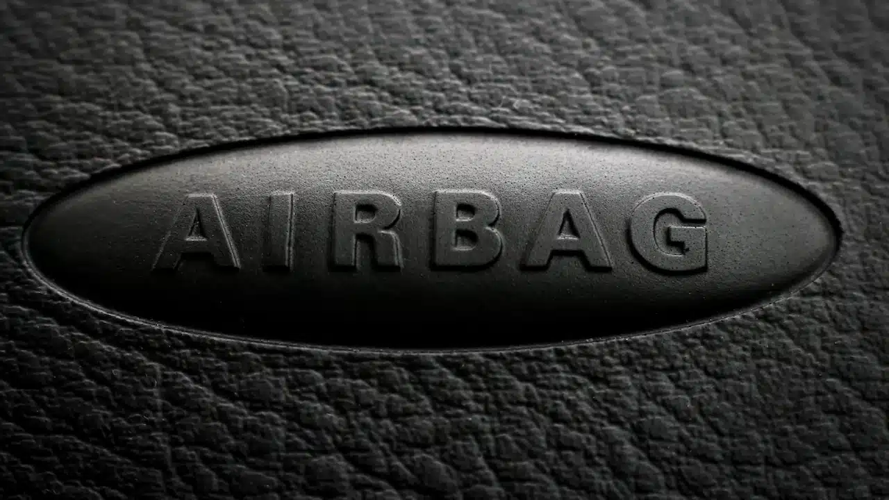 Close-up of airbag inscription on a car dashboard.