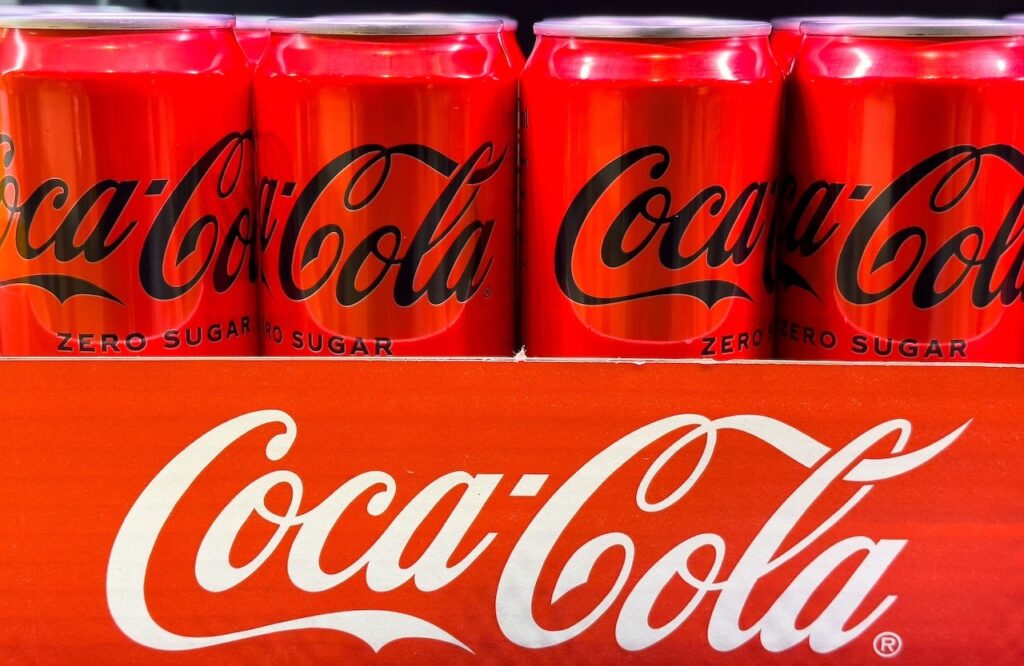 Coca-Cola Zero Sugar cans displayed in bright red packaging
