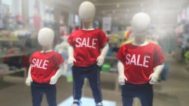 Sign of sale on red children’s clothing in shopping mall, The children’s clothing shop sale