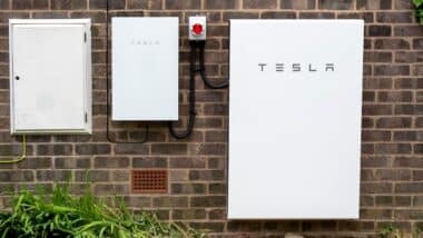 Tesla Powerwall 2 and Backup Gateway 2 installed on a brick house wall