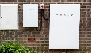 Tesla Powerwall 2 and Backup Gateway 2 installed on a brick house wall