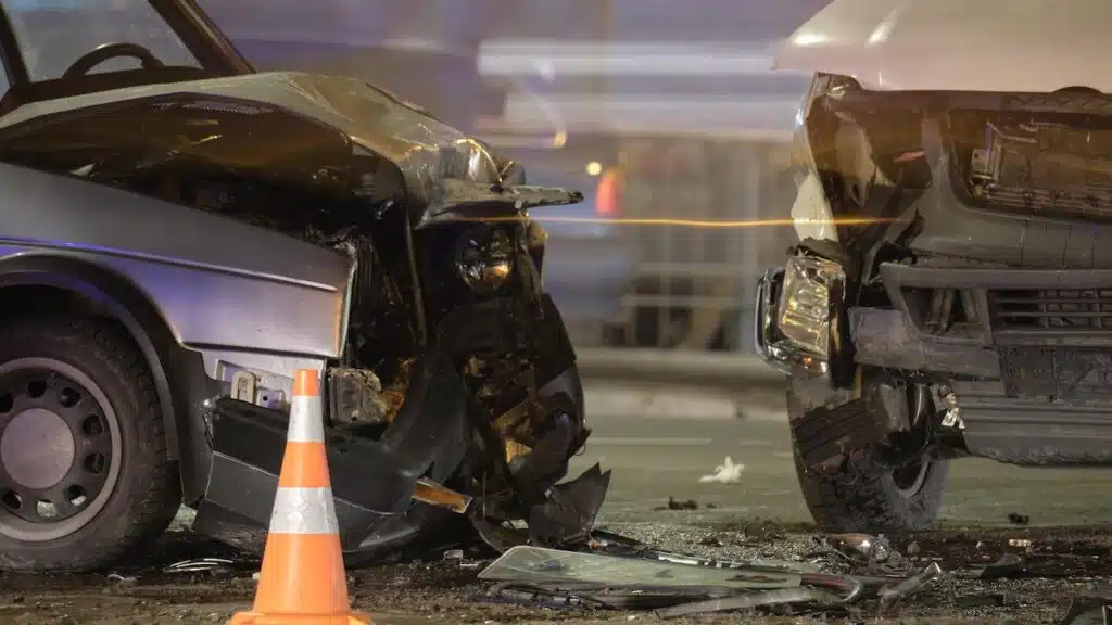 Damaged in heavy car accident vehicles after collision on city street