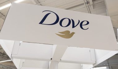 Dove Brand Logo and text sign on shop supermarket display advertising