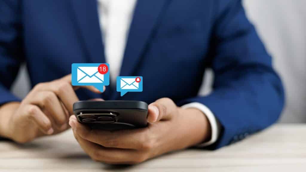 man using smartphone with email