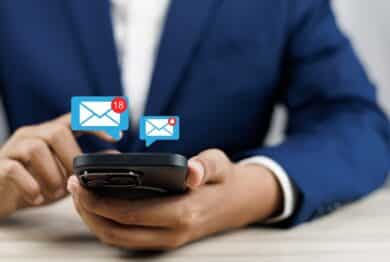 man using smartphone with email