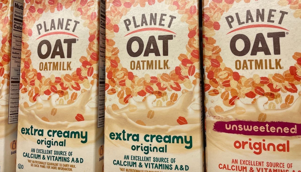 Grocery store Planet Oat Oat Milk on dairy shelf