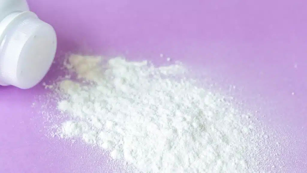 baby powder on purple background