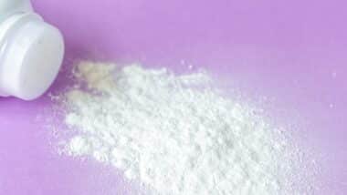 baby powder on purple background