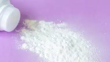 baby powder on purple background
