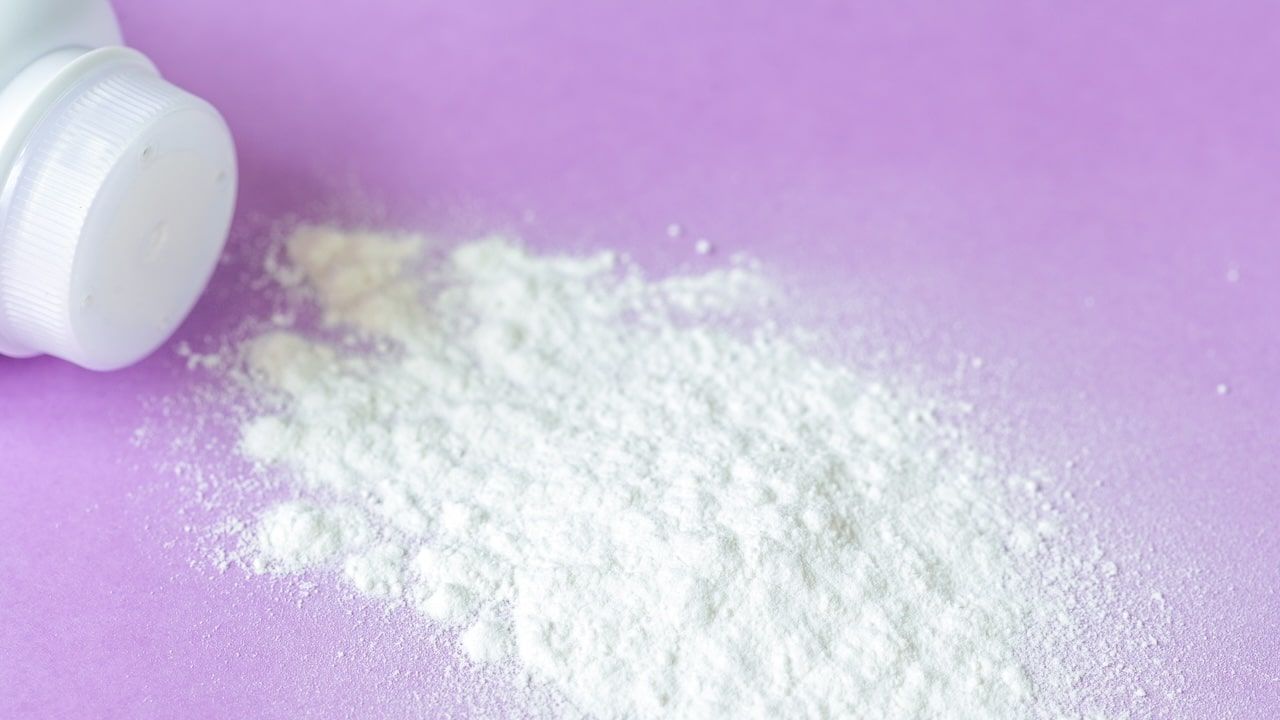 baby powder on purple background