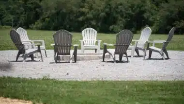 A lot of empty black and white chairs arranged in a circle