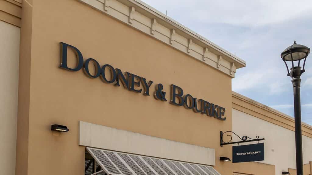 Dooney & Bourke store sign on the wall at Orlando Premium Outlets mall in Florida.