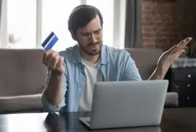 Annoyed frustrated online customer using laptop