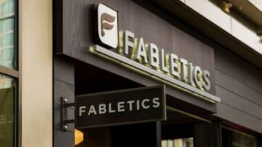 The facade of a Fabletics storefront is displayed.