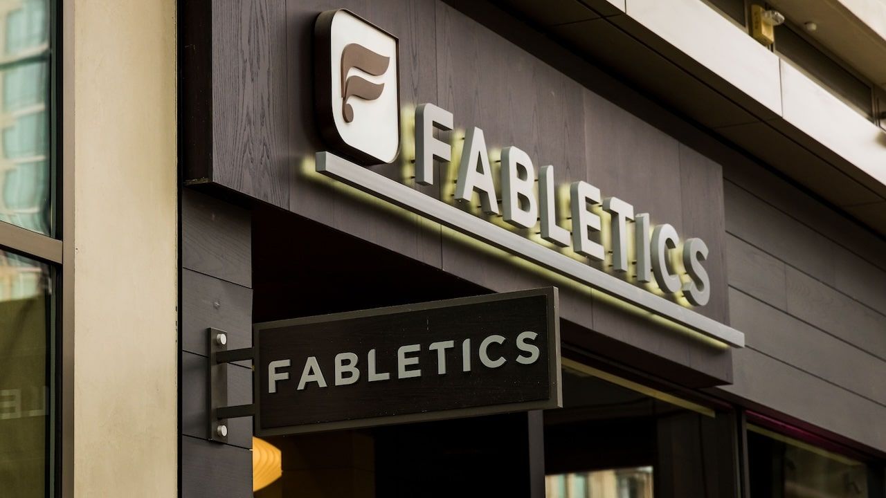 The facade of a Fabletics storefront is displayed.